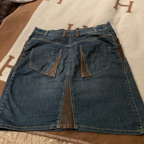 Denim and leather jean skirt. Great for stampede. 
About a size 12 - Picture 2 of 4